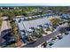 Aerial view of townhouses with parking and landscaping at 9487 Tara Cay Ct, Seminole, FL 33776