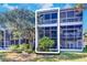 View of private backyard with spacious screened porch at 9487 Tara Cay Ct, Seminole, FL 33776