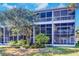 Private backyard with large screened porch and lush landscaping at 9487 Tara Cay Ct, Seminole, FL 33776