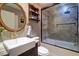 Updated bathroom with a walk-in shower and a modern vanity at 9487 Tara Cay Ct, Seminole, FL 33776