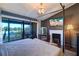 Primary bedroom with water views and fireplace at 9487 Tara Cay Ct, Seminole, FL 33776