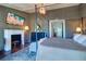 Elegant Primary bedroom with a fireplace and a four-poster bed at 9487 Tara Cay Ct, Seminole, FL 33776