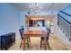 Bright dining room with farmhouse table and kitchen view at 9487 Tara Cay Ct, Seminole, FL 33776