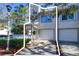 Front view of the property showcasing two-car garage at 9487 Tara Cay Ct, Seminole, FL 33776