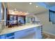 Granite island kitchen with modern fixtures and cabinets at 9487 Tara Cay Ct, Seminole, FL 33776