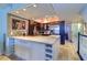 Modern kitchen with granite countertops and stainless steel appliances at 9487 Tara Cay Ct, Seminole, FL 33776