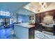 Open concept kitchen with island and living area view at 9487 Tara Cay Ct, Seminole, FL 33776