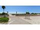 Paved beach access with bike rack and signage at 11000 Gulf Blvd # 703, Treasure Island, FL 33706