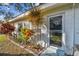 Tropical landscaping and entryway to a charming single-story home at 11200 102Nd Ave # 90, Seminole, FL 33778