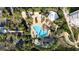 Aerial view of resort-style pool, lush landscaping, and beach access at 1200 Gulf Blvd # 206, Clearwater Beach, FL 33767