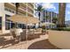 Outdoor patio with seating and umbrellas at 1200 Gulf Blvd # 206, Clearwater Beach, FL 33767