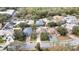 Aerial view of a residential neighborhood showcasing well-maintained homes and tree-lined streets in a quiet community at 12119 Hunters Lake Dr, New Port Richey, FL 34654