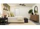 Relaxing bedroom with wooden accents, green and white color scheme, and ceiling fan at 13668 Newbridge St, Spring Hill, FL 34609