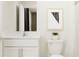 Bright, clean bathroom with white vanity, marble countertop, and modern fixtures at 15129 Rainbow Quartz St, Wimauma, FL 33598