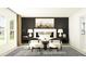 Modern bedroom features a dark accent wall, white bedding, and stylish seating area at 15129 Rainbow Quartz St, Wimauma, FL 33598