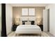 Cozy bedroom with a comfortable bed, stylish nightstands, and a neutral color palette at 15129 Rainbow Quartz St, Wimauma, FL 33598