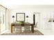 Dining room with wooden table, woven chairs, and view of the kitchen at 15129 Rainbow Quartz St, Wimauma, FL 33598