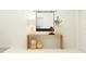 Entryway with wooden console table, mirror, and decorative vases at 15129 Rainbow Quartz St, Wimauma, FL 33598