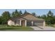 Charming single-story home with a two-car garage and landscaped front yard at 15129 Rainbow Quartz St, Wimauma, FL 33598