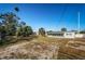 Expansive backyard with a view of the home's rear exterior at 1536 77Th N Ave, St Petersburg, FL 33702