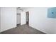 Empty bedroom with gray carpet and open door to another room at 1536 77Th N Ave, St Petersburg, FL 33702