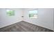 Empty bedroom with plush gray carpet and several windows at 1536 77Th N Ave, St Petersburg, FL 33702