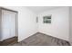Empty bedroom with gray carpet, closet, and louvered closet doors at 1536 77Th N Ave, St Petersburg, FL 33702