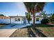 Charming single-story home with palm tree and updated windows at 1536 77Th N Ave, St Petersburg, FL 33702