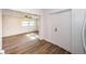 Hallway with wood-look tile floors leading to a door at 1536 77Th N Ave, St Petersburg, FL 33702