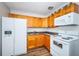 Kitchen boasting white appliances, granite countertops, and wood cabinets at 1536 77Th N Ave, St Petersburg, FL 33702