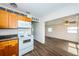 Kitchen with wood cabinetry, granite countertops, and white appliances at 1536 77Th N Ave, St Petersburg, FL 33702