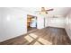 Open living area with wood-look tile and view of the kitchen at 1536 77Th N Ave, St Petersburg, FL 33702
