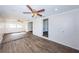Bright living room with wood-look tile floors and ceiling fan at 1536 77Th N Ave, St Petersburg, FL 33702