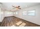Large living area with wood-look tile flooring, ceiling fans, and ample natural light at 1536 77Th N Ave, St Petersburg, FL 33702