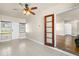 Bonus room with tile flooring, ceiling fan, and access to another room at 1859 East Dr, Clearwater, FL 33755