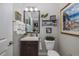 Small half bathroom with single vanity, toilet, and decorative mirror at 19218 Alexandrea Lee Ct, Land O Lakes, FL 34638