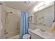 Bathroom with tub/shower, single vanity, and light tile at 2003 Halmrock Pl, Sun City Center, FL 33573