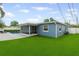 Beautiful backyard with a screened-in patio and a refreshing in-ground swimming pool at 2461 61St N Ln, St Petersburg, FL 33710