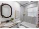 Updated bathroom with tiled walls, a bathtub, and modern fixtures at 2461 61St N Ln, St Petersburg, FL 33710