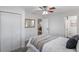 Bright bedroom featuring a ceiling fan, closet, and carpeted floors at 2461 61St N Ln, St Petersburg, FL 33710