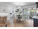Dining area with sliding glass doors leading to the outdoors, adjacent to a modern kitchen at 2461 61St N Ln, St Petersburg, FL 33710