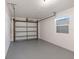 Spacious, well-lit one-car garage with a window and finished floor at 2461 61St N Ln, St Petersburg, FL 33710