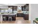 Modern kitchen with dark wood cabinets, stainless steel appliances, and an island at 2461 61St N Ln, St Petersburg, FL 33710