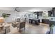 Open concept living room and kitchen area with modern furniture and tile floors at 2461 61St N Ln, St Petersburg, FL 33710