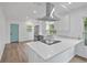 Modern white kitchen with stainless steel appliances and white countertops at 3407 E 24Th Ave, Tampa, FL 33605