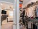 Walk-in closet with organized shelving and hanging rods, accessible from main bedroom at 37868 Beacon Brick Dr, Zephyrhills, FL 33540