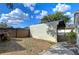 A metal carport with wooden fencing at 38916 11Th Ave, Zephyrhills, FL 33542