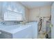 Laundry room with washer, dryer, and water heater at 38916 11Th Ave, Zephyrhills, FL 33542