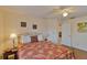 Bedroom with a ceiling fan and window at 411 Belle Isle Ave, Belleair Beach, FL 33786