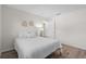 Calm bedroom with a bed featuring white bedding and minimalist decorations at 5101 Huntington Ne Cir, St Petersburg, FL 33703